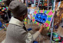 An artist painting on canvas in the connection of upcoming New Year