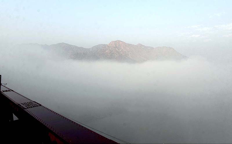 A view of thick fog over Indus River through Attock Bridge