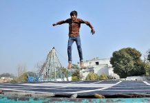 Teenager jumping on trampoline at G-7