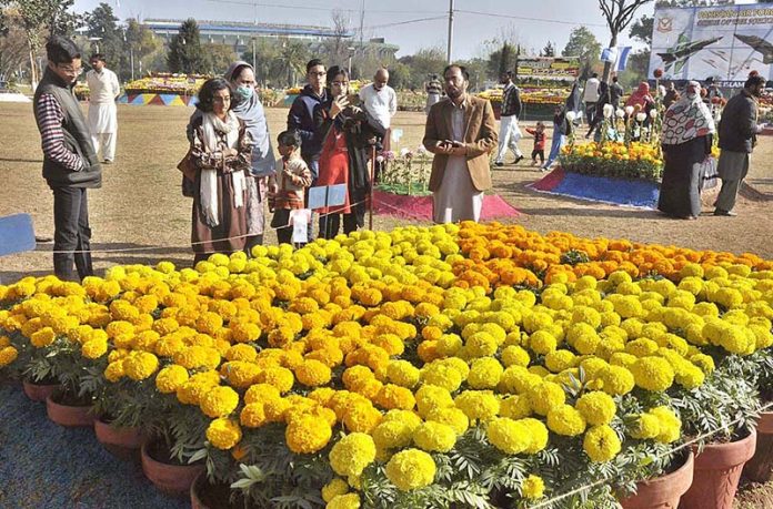 Visitors keenly viewing flowers during Chrysanthemum, Marigold & Autumn Flowers Show, 2022 at Rose and Jasmine Garden