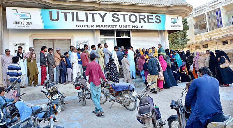 People standing in a queue outside Utility Store to purchase grocery items on subsidized rates at Nursery Park Road