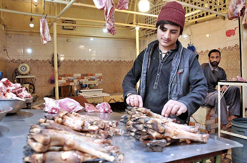 A Vendor displaying mutton trotters to attract the customers at his shop