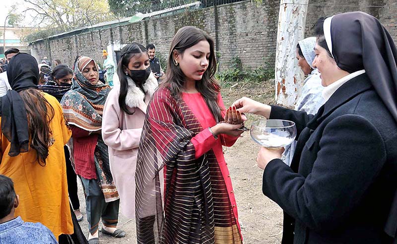 Christian community members performing religious rituals on Christmas day at Fatima Church