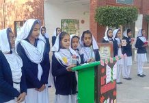 Students addressing and offering special Dua in a ceremony at the Crescent School Boys & Girls (P.B) on the eve of Youm Shuda Army Public School Peshawar.