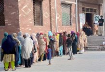 Many deserving women waiting for their turn to receive cash under Benazir Income Support Program by Govt. at Al-Fatah Sports Complex Saleemi Chowk