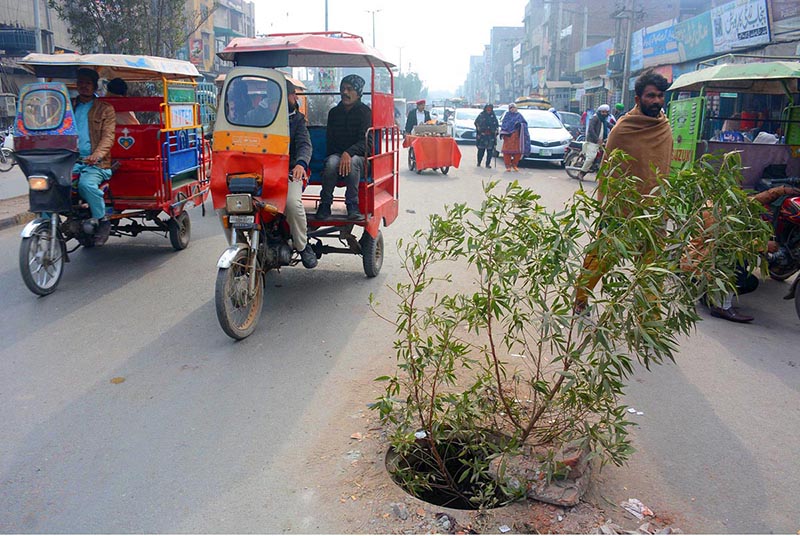 A view of open sewerage main hole in the middle of Dijkot Road near Market Committee which could lead to any accident