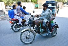 Disable person riding motorbike at Court Road