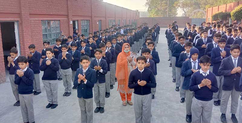 Students addressing and offering special Dua in a ceremony at the Crescent School Boys & Girls (P.B) on the eve of Youm Shuda Army Public School Peshawar.