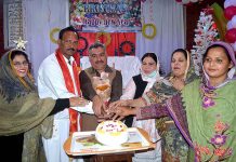 Chairman PHA Shafique Sindhu and Pastor Zafer cuts the cake in connection with Christmas at UP Church Nori Gate