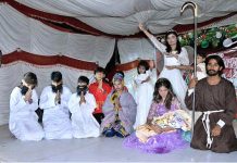 Christian students performing religious stage drama at St. Anthony Catholic Church in connection with upcoming Christmas
