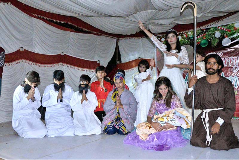 Christian students performing religious stage drama at St. Anthony Catholic Church in connection with upcoming Christmas