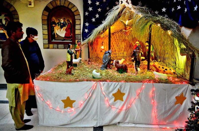 St. Francis Church illuminated with colorful lights ahead of Christmas celebrations.