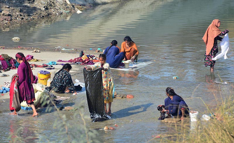 Gypsy women washing their cloths at Channel Mori Canal