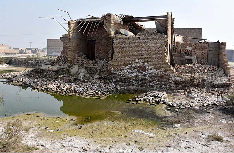 A view of submerged houses after flash flood water as millions of houses and roads damaged and washed away due to deadly flood hit the area of Teacher Colony near City