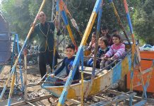 Children enjoying the swing at Latifabad.