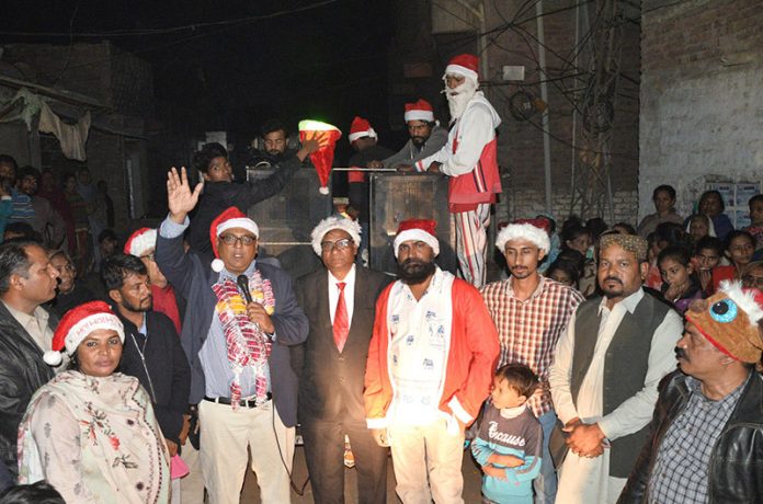 Christian community participating in a rally on the eve of Christmas celebration at Latifabad.