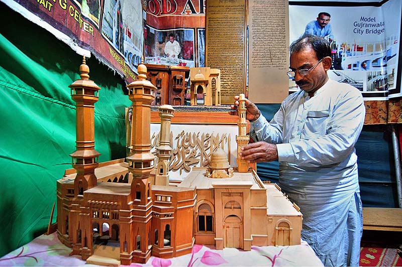 An artisan demonstrating his skills at a stall during Folk Festival ‘Lok Mela’ 2022 at Lok Virsa