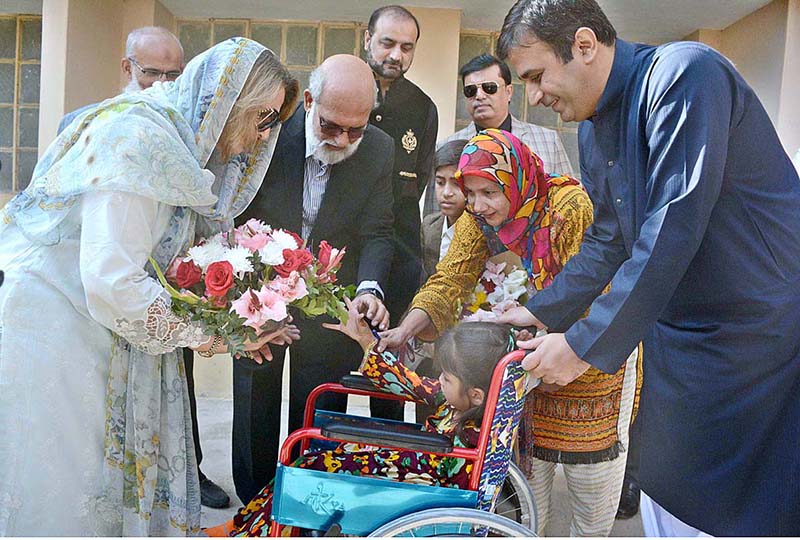 A differently-abled girl presenting bouquet to Begum Samina Arif Alvi on her arrival at Special Children’s Sports Gala and Scouting event organized by Institute of Holistic Rehabilitation and Inclusion (IHRI) in collaboration with World Memon Organization at Raunaq-e-Islam Girls Secondary School