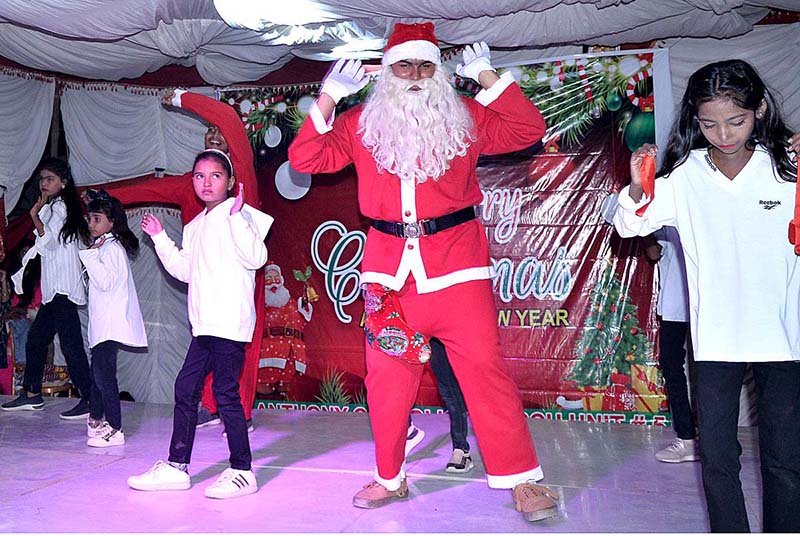 Christian students performing tableau during stage drama at St. Anthony Catholic Church in connection with upcoming Christmas