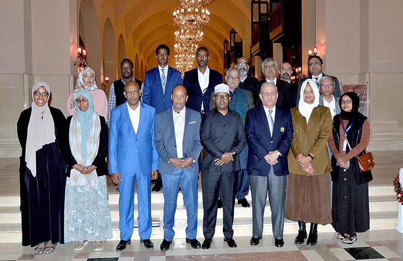 Senator Mian Raza Rabbani presenting a book to Ahmad Osman Aden, Deputy Minister of Interior Galmudug State