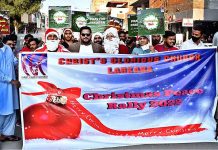 Christian community participates in a rally in connection with upcoming Christmas celebration at Royal Road