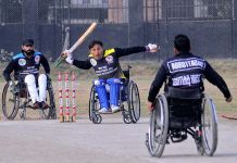 A view of disable person’s cricket match playing between Peshawar and Abbottabad teams during National Special Sports Festival to mark with International Day of Persons with Disabilities organized by Society for Special Persons at Sports Ground