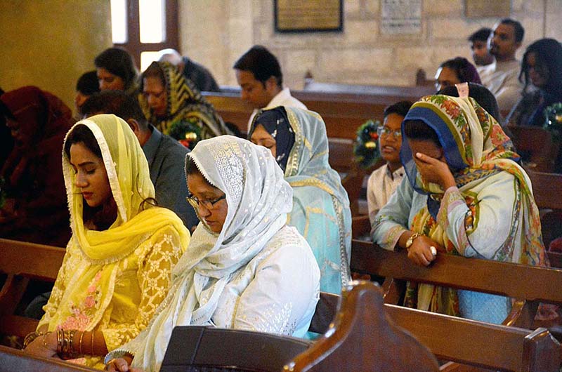 Christian community members performing religious rituals on the occasion of Christmas day