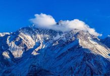 An attractive and eye catching view of last sun set shines on fresh snow covered mountains.