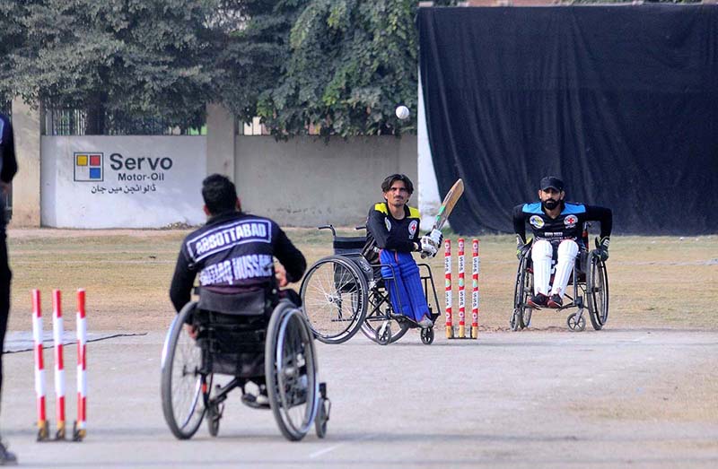 A view of disable person’s cricket match playing between Peshawar and Abbottabad teams during National Special Sports Festival to mark with International Day of Persons with Disabilities organized by Society for Special Persons at Sports Ground