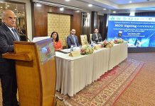 Special Assistant to the Prime Minister on Government Effectiveness Muhammad Jahanzeb Khan addressing the MOU signing ceremony in a local hotel