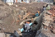 Labourer busy in construction work of a sewerage pipeline at Lohari Gate