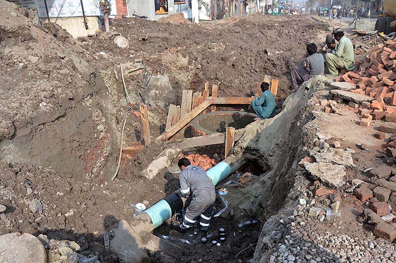 Labourer busy in construction work of a sewerage pipeline at Lohari Gate