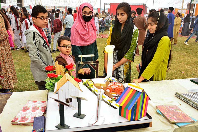 Student visitors are viewing the models made by students during All Sindh Private Schools Science & Art exhibition at Public School