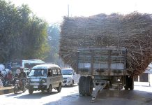 A trolley loaded with sugarcanes parked in the middle of a busy road near Allied Chowk creating hurdles in smooth flow of traffic and needs the attention of the concerned authorities