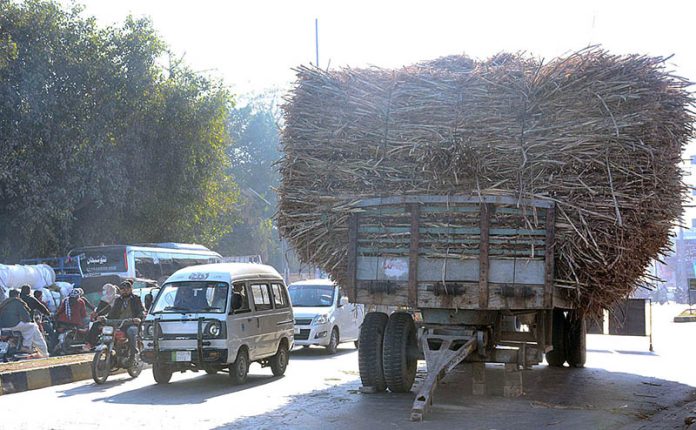 A trolley loaded with sugarcanes parked in the middle of a busy road near Allied Chowk creating hurdles in smooth flow of traffic and needs the attention of the concerned authorities