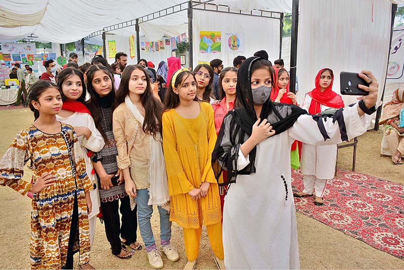 Student visitors are viewing the models made by students during All Sindh Private Schools Science & Art exhibition at Public School