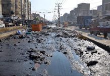 A view of sewerage water accumulated and garbage at Latifabad Road, which required the attention of concerned authorities