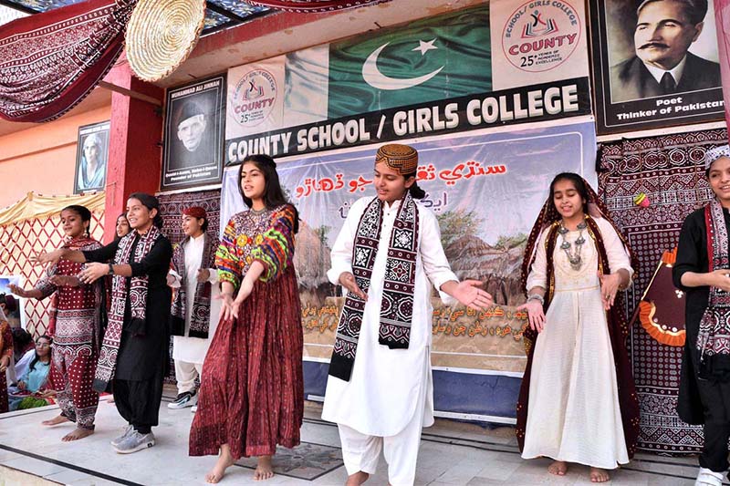 Students are performing tableau during Sindhi Culture Day at County Cambridge School.