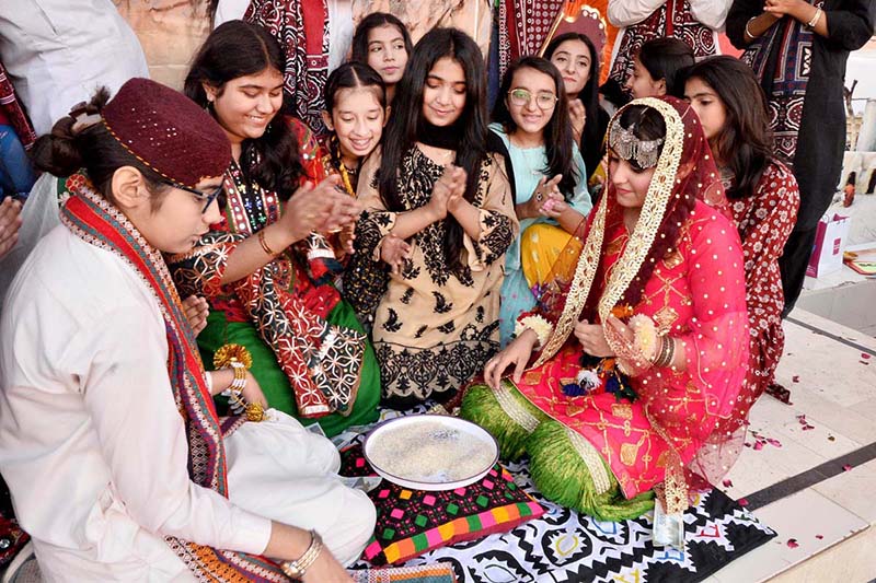 Students are performing tableau during Sindhi Culture Day at County Cambridge School.