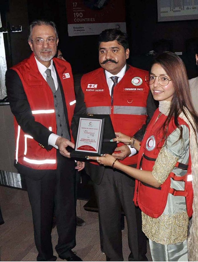 Chairman Pakistan Red Crescent Society Sardar Shahid Ahmed Laghari and Ambassador of Turkiya, Mehmet Pacaci giving away shield to a participant during the 