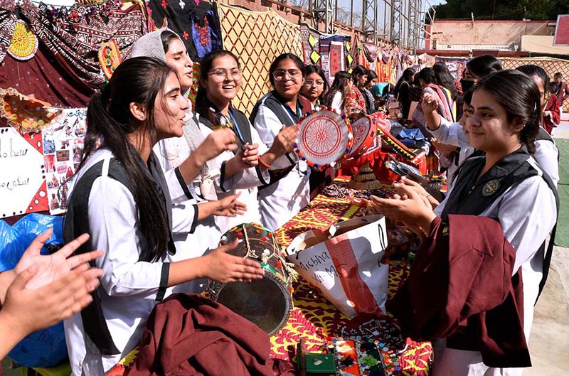 Students are performing tableau during Sindhi Culture Day at County Cambridge School.