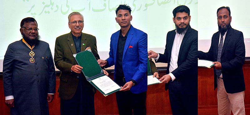 President Dr. Arif Alvi distributing the cheques of refund to taxpayers during the awareness seminar organized by Federal Tax ombudsman at Governor House.