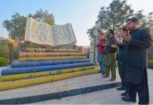 Students offering Fateha for APS martyrs at Martyrs' Monument in Peshawar Archives Library on the day of APS tragic incident.