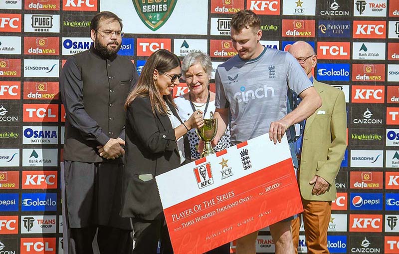 Harry Brook receives “Player of the Series Award” from a representative of KFC after winning the third test and series against Pakistan at the National Stadium