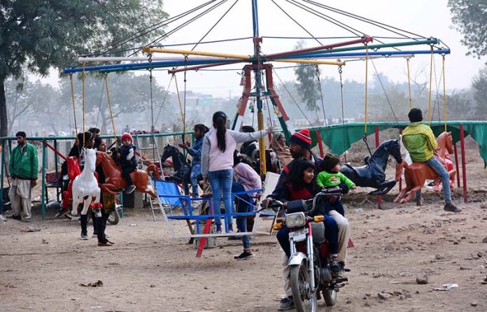 Children enjoy swing at a local park