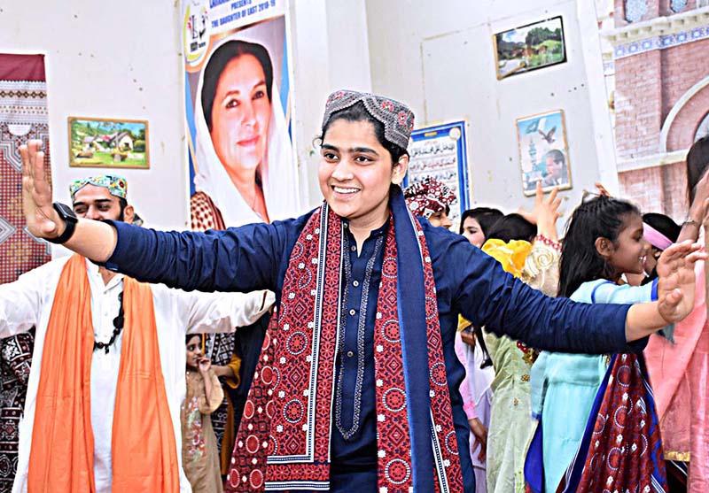 Student performing during cultural program to mark the Sindhi Ajrak Topi Culture Day at Government Girls Higher Secondary School