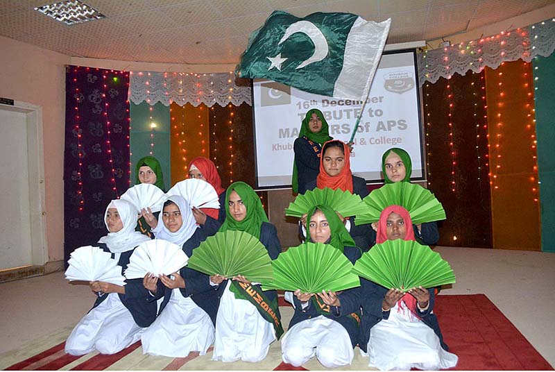 Students are performing tableau to tribute martyrs of APS Peshawar at Khubaib Girls School and College.