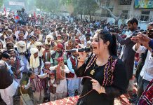 Female singer performing a sindhi song on the stage during culture program during the Sindhi Ajrak Topi culture day at radio Pakistan road.