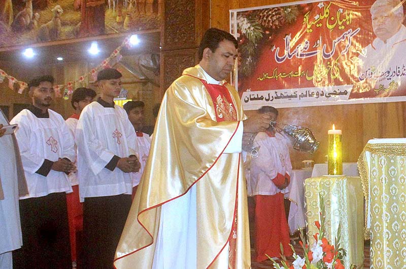 People from Christian community performing their religious rituals on a Christmas Day at Catholic Church.