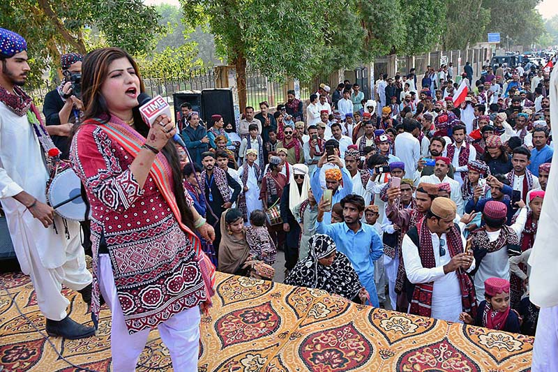 Female singer performing a sindhi song on the stage during culture program during the Sindhi Ajrak Topi culture day at radio Pakistan road.